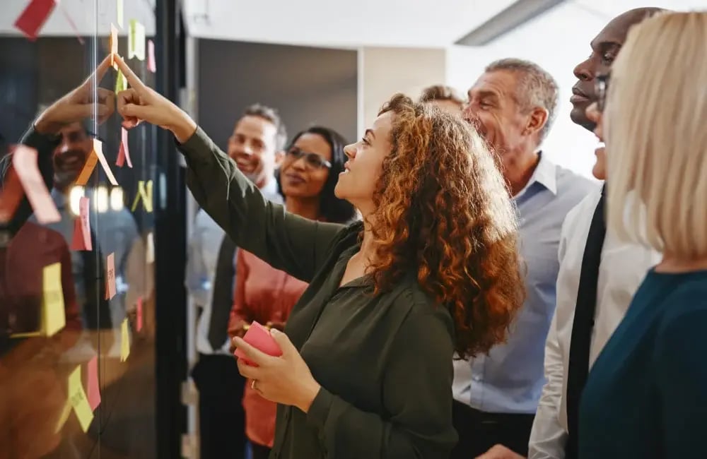people_looking_at_pin_board