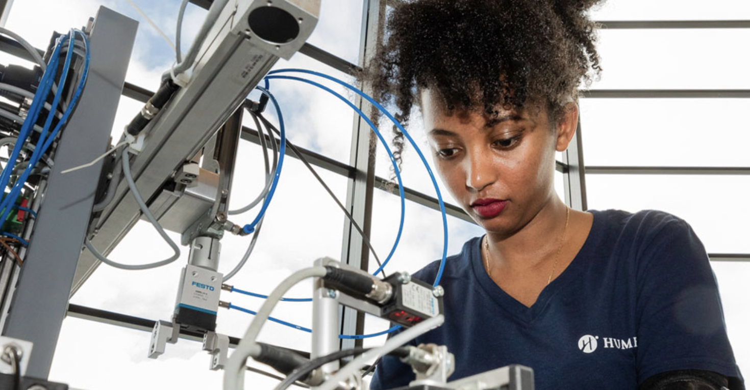 young woman working in an engineering lab